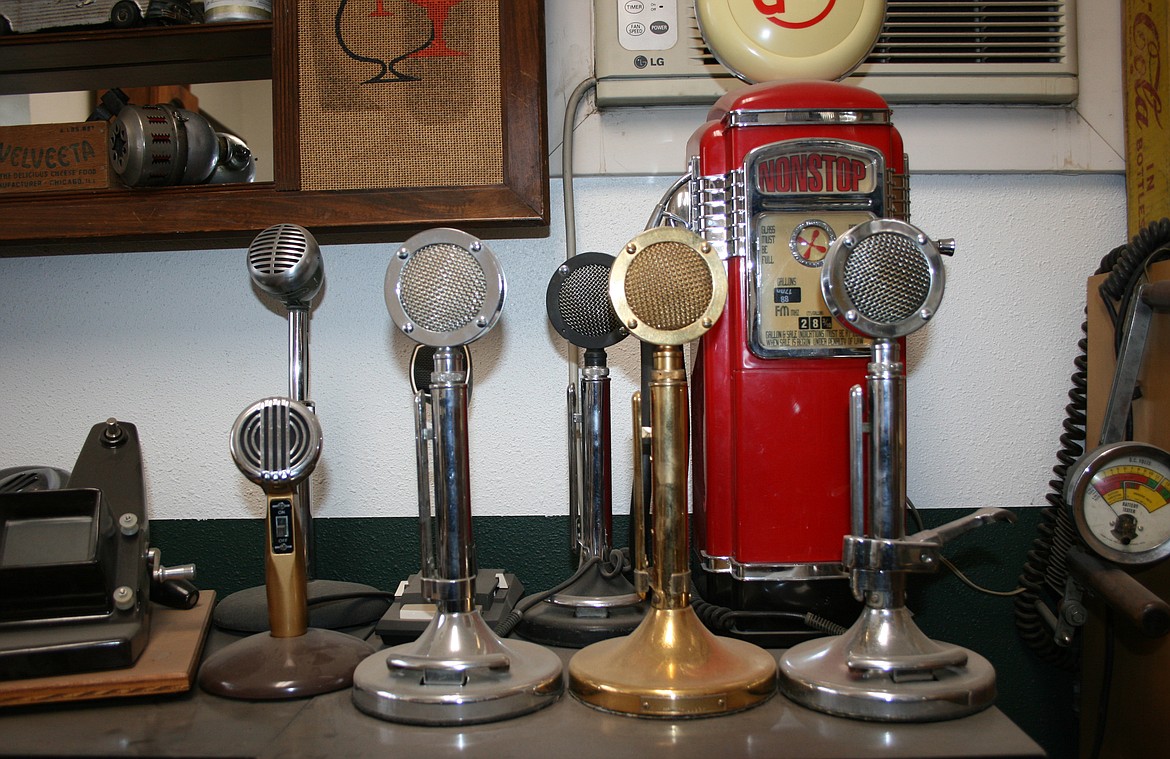 Vintage microphones cluster on a waiting room table Tuesday at Shade Tree Customs in Moses Lake.