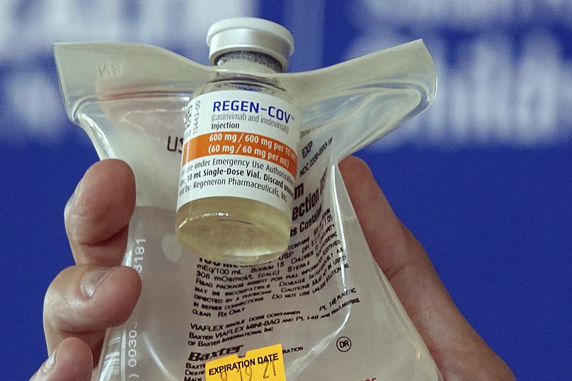 A doctor holds a Regeneron monoclonal antibody infusion bag during a news conference Thursday, Aug. 19, 2021 at a hospital in Fort Lauderdale, Fla. (Joe Cavaretta/South Florida Sun-Sentinel via AP, File)