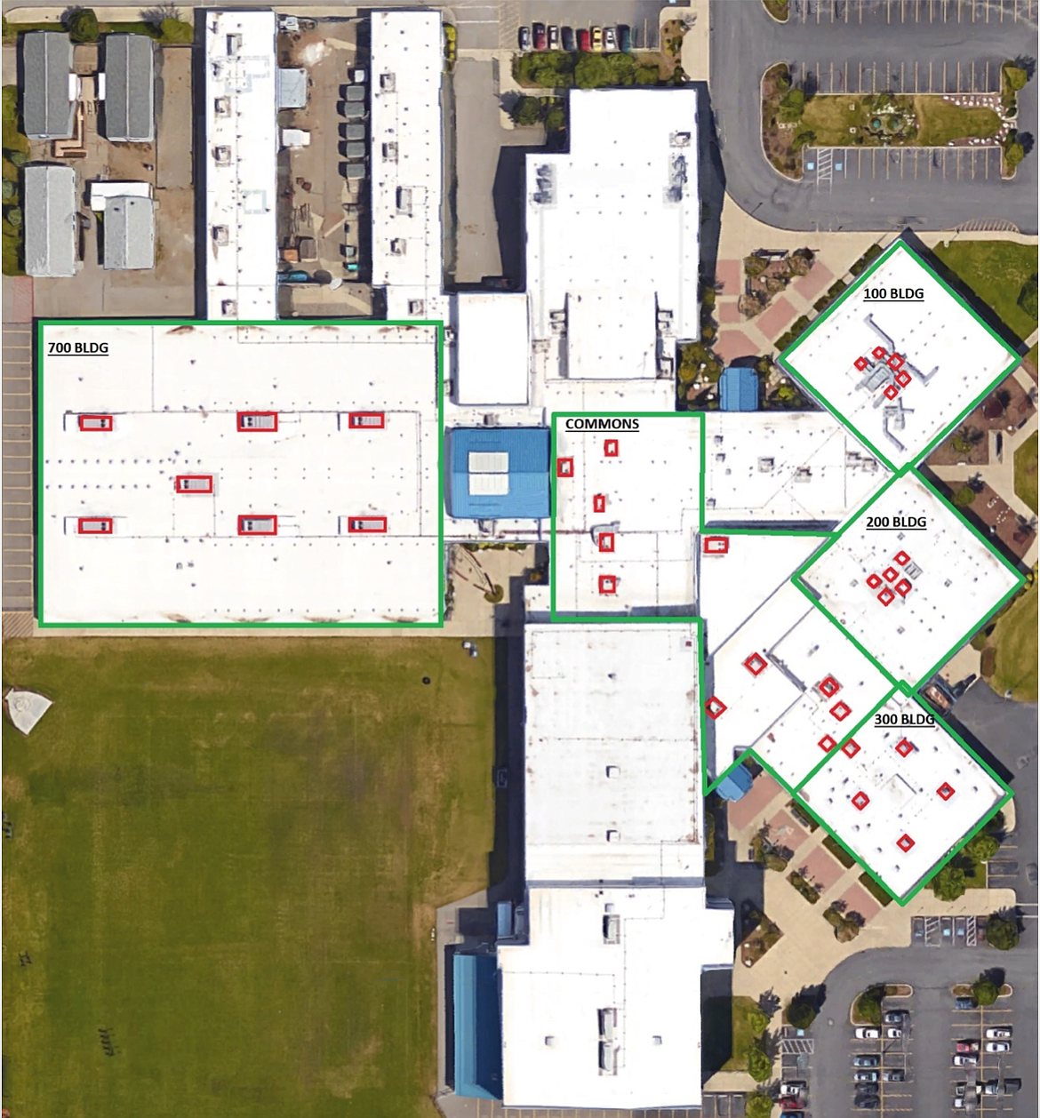 This image of Coeur d'Alene High School uses green outlines to identify the building areas being considered for upgrades. The red outlines surround the HVAC units that are proposed to be replaced. Courtesy of the Coeur d'Alene School District