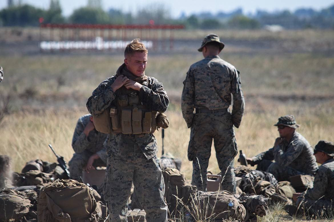 Marines bivouacking at the Grant County International Airport in July 2021, during the Summer Fury 2021 military exercise, prepare to deploy for training.