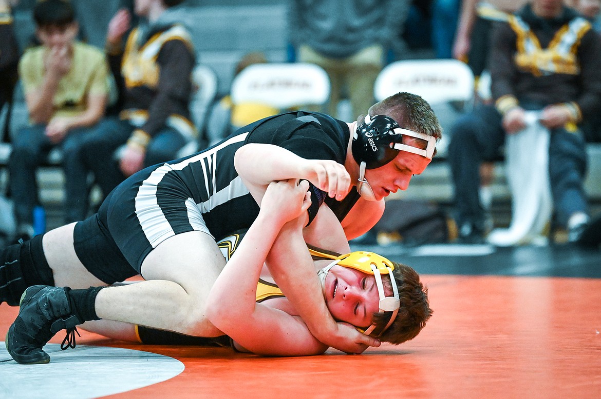 Flathead's Mason Doran works toward a pin of Helena Capital's Tyler Crum at 170 pounds at Flathead High School on Friday, Jan. 28. (Casey Kreider/Daily Inter Lake)