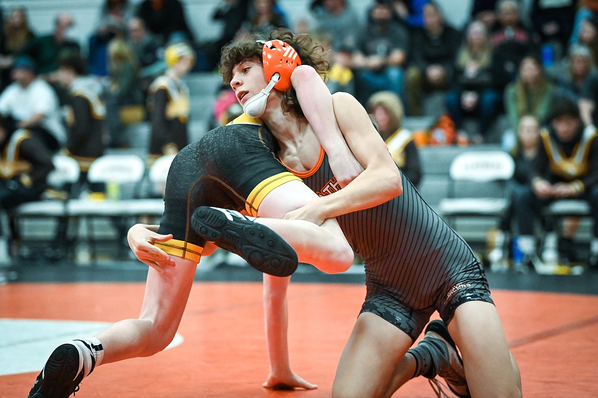 Flathead's Will Barnes wrestles Helena Capital's Cohen Sassano at 113 pounds at Flathead High School on Friday, Jan. 28. (Casey Kreider/Daily Inter Lake)