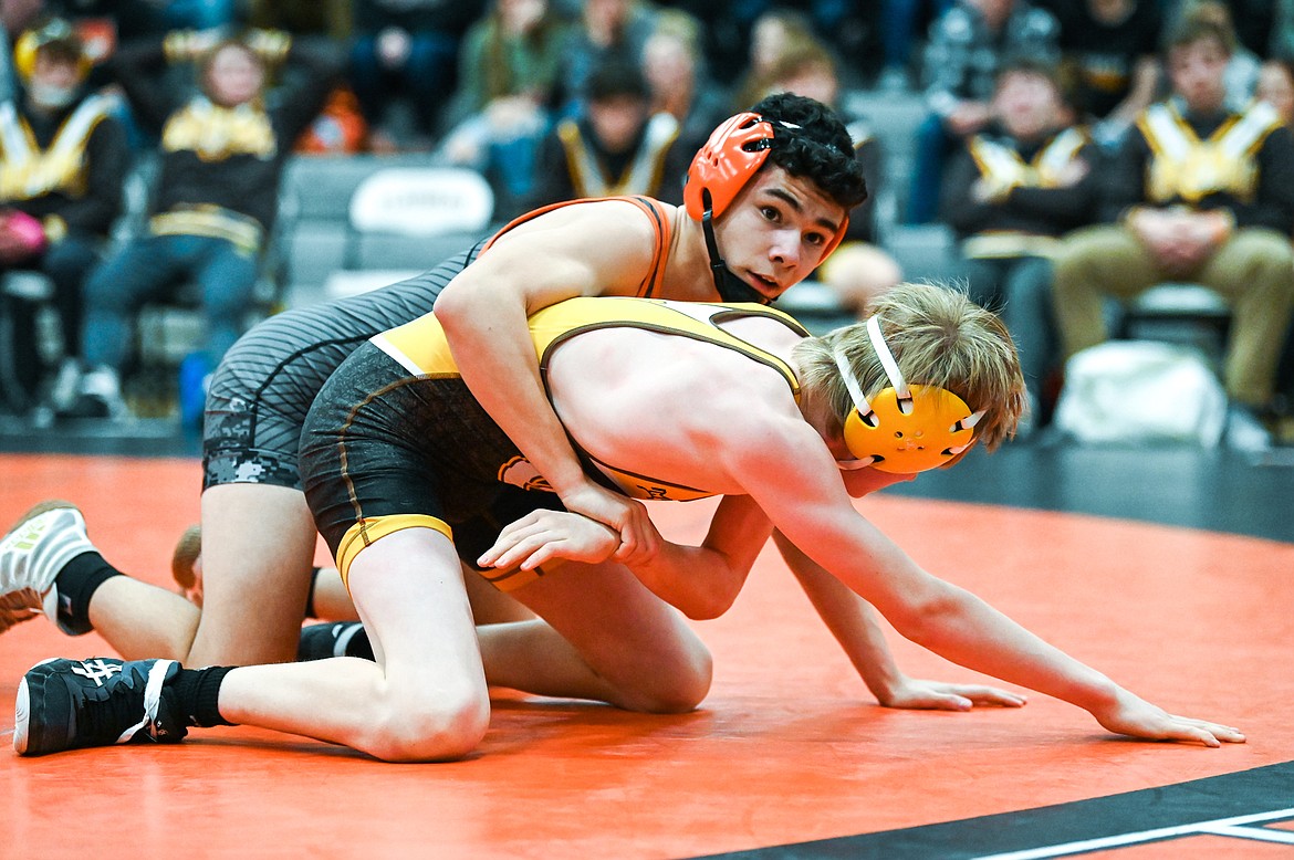 Flathead's Diesel Thompson wrestles Helena Capital's Dustin Campbell at 120 pounds at Flathead High School on Friday, Jan. 28. (Casey Kreider/Daily Inter Lake)