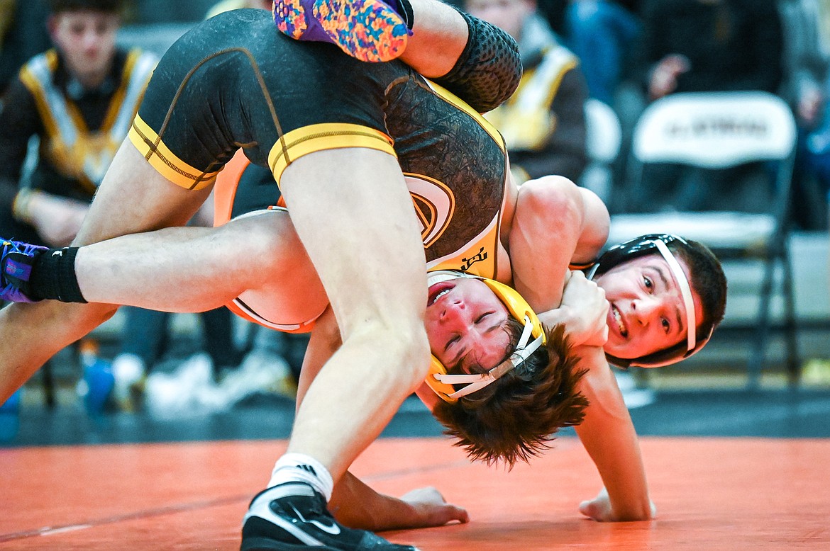 Flathead's Gunnar Thompson wrestles Helena Capital's Cole Graham at 152 pounds at Flathead High School on Friday, Jan. 28. (Casey Kreider/Daily Inter Lake)