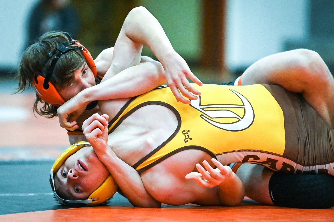 Flathead's Dane Lake wrestles Helena Capital's Dawson Peterson at 126 pounds at Flathead High School on Friday, Jan. 28. (Casey Kreider/Daily Inter Lake)