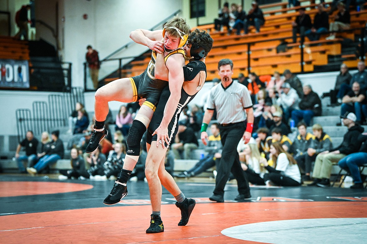 Flathead's Asher Kemppainen wrestles Helena Capital's Carson DesRosier at 138 pounds at Flathead High School on Friday, Jan. 28. (Casey Kreider/Daily Inter Lake)