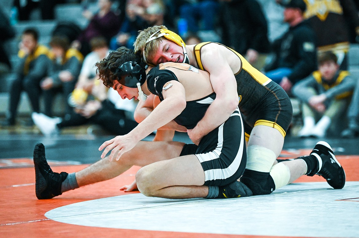 Flathead's Asher Kemppainen wrestles Helena Capital's Carson DesRosier at 138 pounds at Flathead High School on Friday, Jan. 28. (Casey Kreider/Daily Inter Lake)