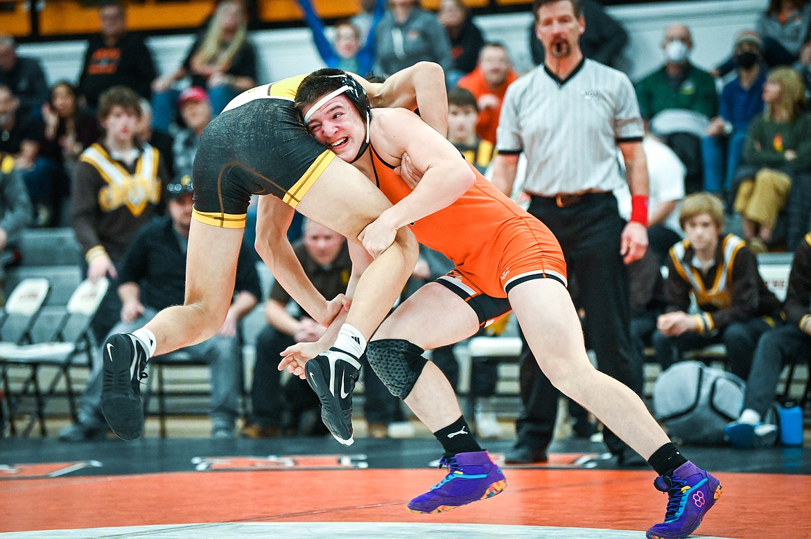 Flathead's Gunnar Thompson wrestles Helena Capital's Cole Graham at 152 pounds at Flathead High School on Friday, Jan. 28. (Casey Kreider/Daily Inter Lake)