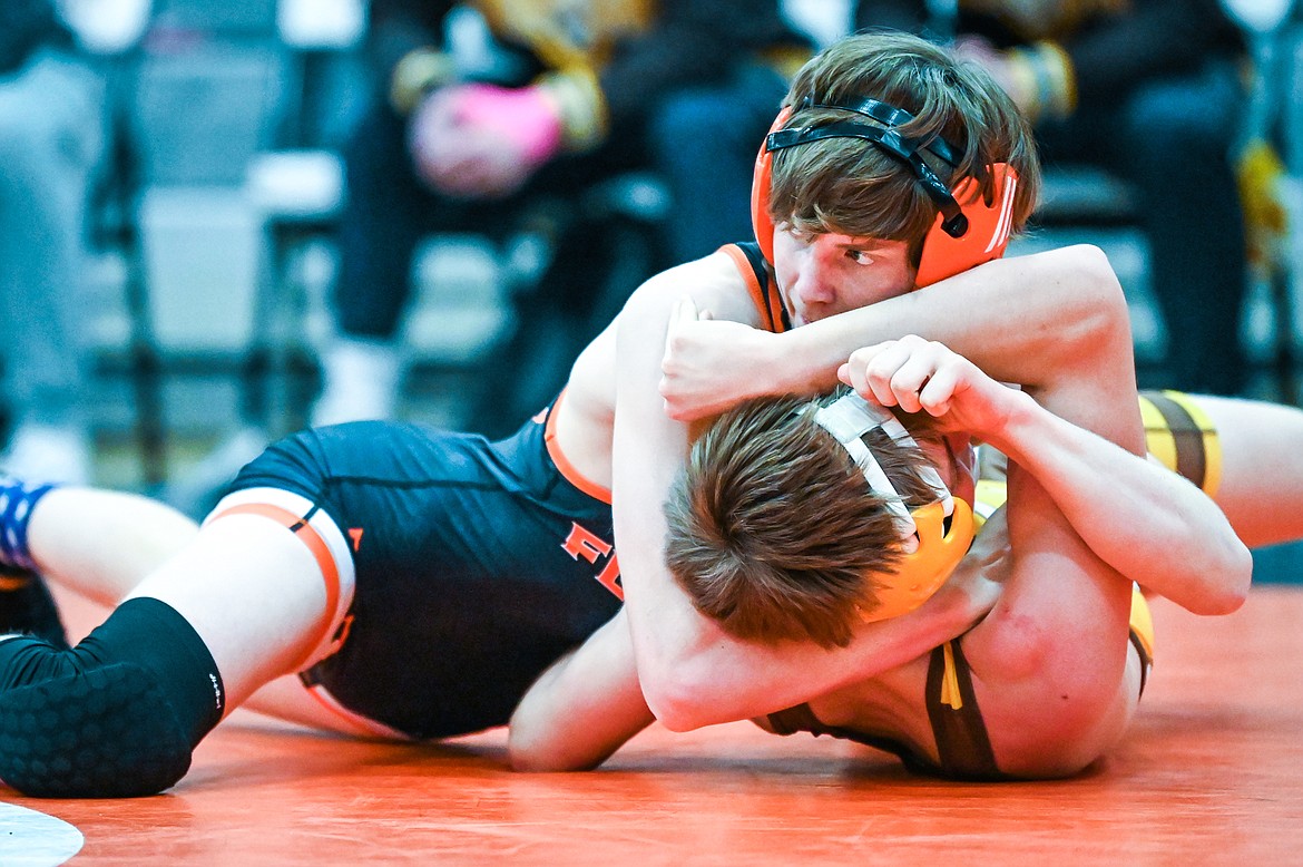 Flathead's Dane Lake wrestles Helena Capital's Dawson Peterson at 126 pounds at Flathead High School on Friday, Jan. 28. (Casey Kreider/Daily Inter Lake)