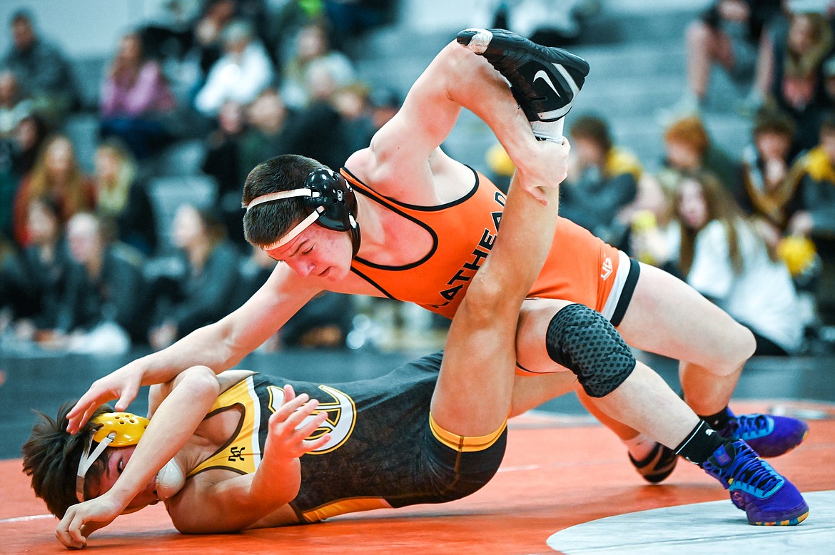 Flathead's Gunnar Thompson wrestles Helena Capital's Cole Graham at 152 pounds at Flathead High School on Friday, Jan. 28. (Casey Kreider/Daily Inter Lake)