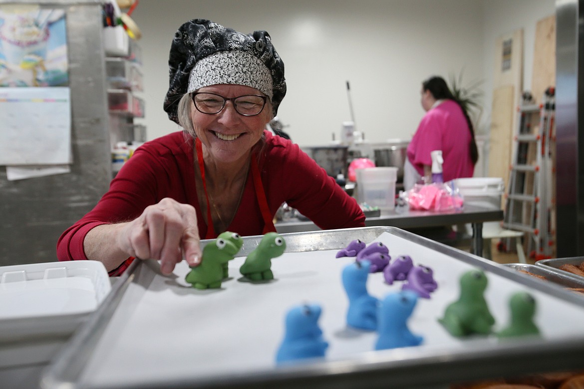 "Miss Judy" Kannegaard, head pastry chef for the Village Bakery, makes cute fondant creatures Thursday morning. The Village Bakery will have a grand opening and ribbon cutting ceremony Tuesday at 10 a.m.