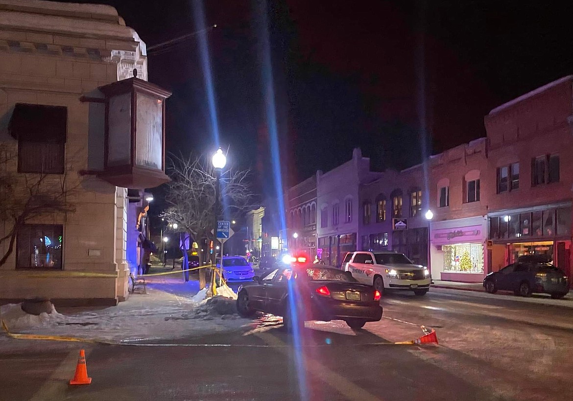 Shoshone County Sheriff's Office deputies process the vehicle that Jesse R. Spitzer abandoned in Wallace late Thursday night after stealing a truck at gunpoint from residents on Bank Street. No one was harmed in the incident and Spitzer used the stolen to head east into Montana, where he was taken into custody Friday morning.