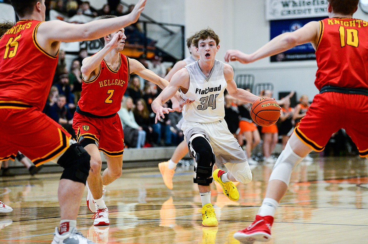 Flathead's Joston Cripe (34) looks for room in the paint against the Missoula Hellgate defense at Flathead High School on Saturday, Jan. 29. (Casey Kreider/Daily Inter Lake)