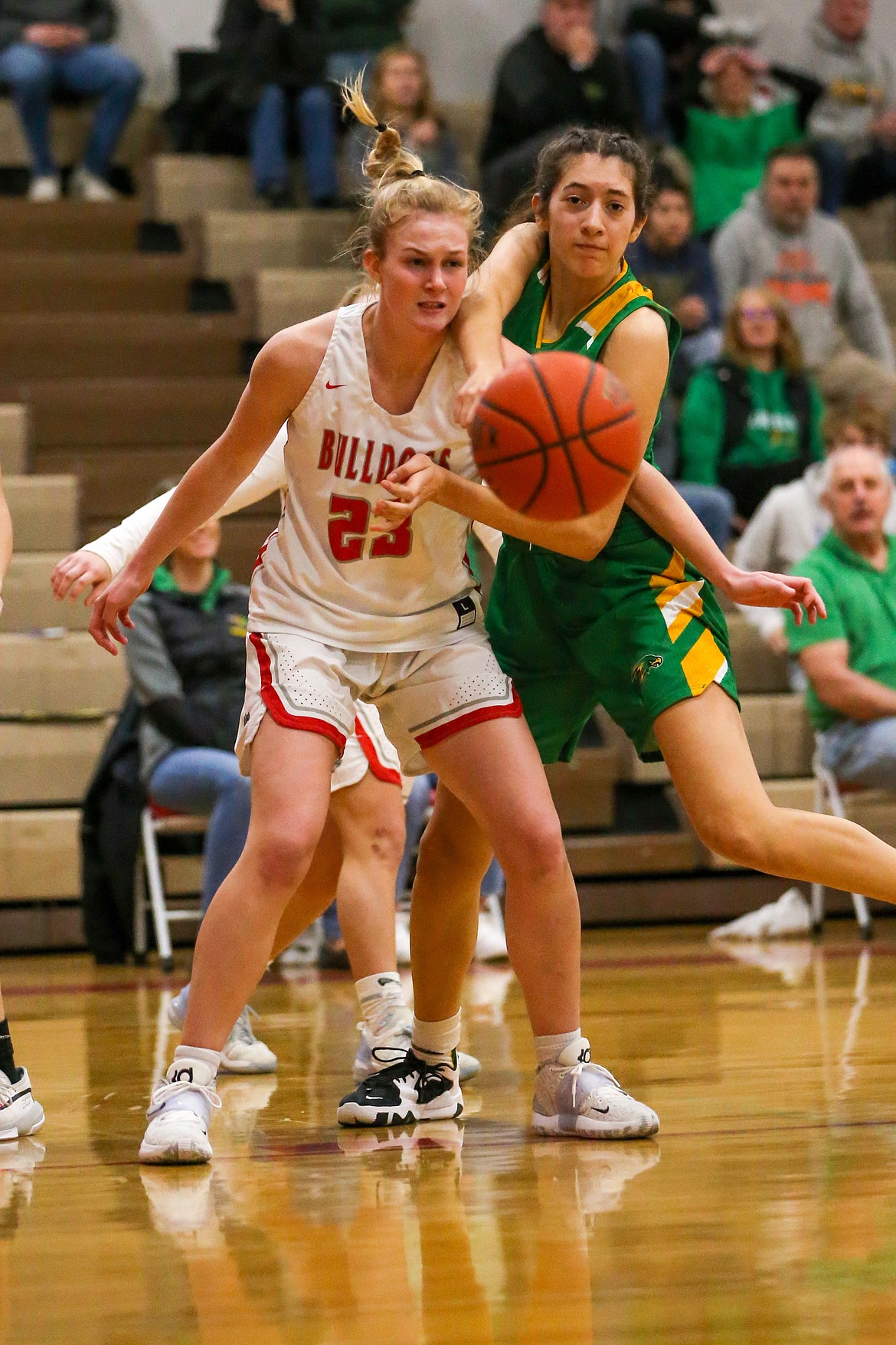 Senior Sofia Platte (left) fights for a loose ball with a Lakeland player during Saturday's game.