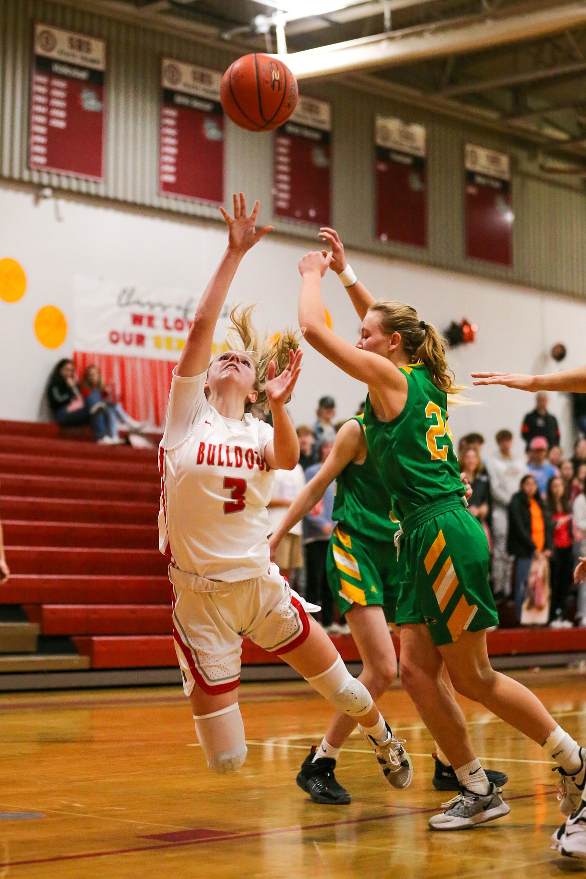 Junior Daylee Driggs attempts a shot while falling to the floor during Saturday's game against Lakeland at Les Rogers Court. She scored a career-high 23 points.