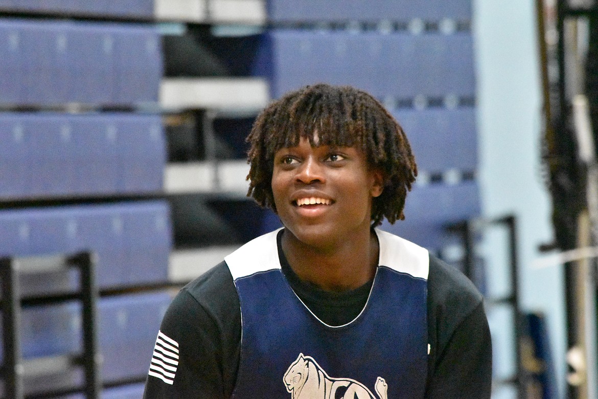 Moses Lake Christian Academy/Covenant Christian School’s Pierre Boorman smiles before taking a shot during basketball practice on Wednesday.