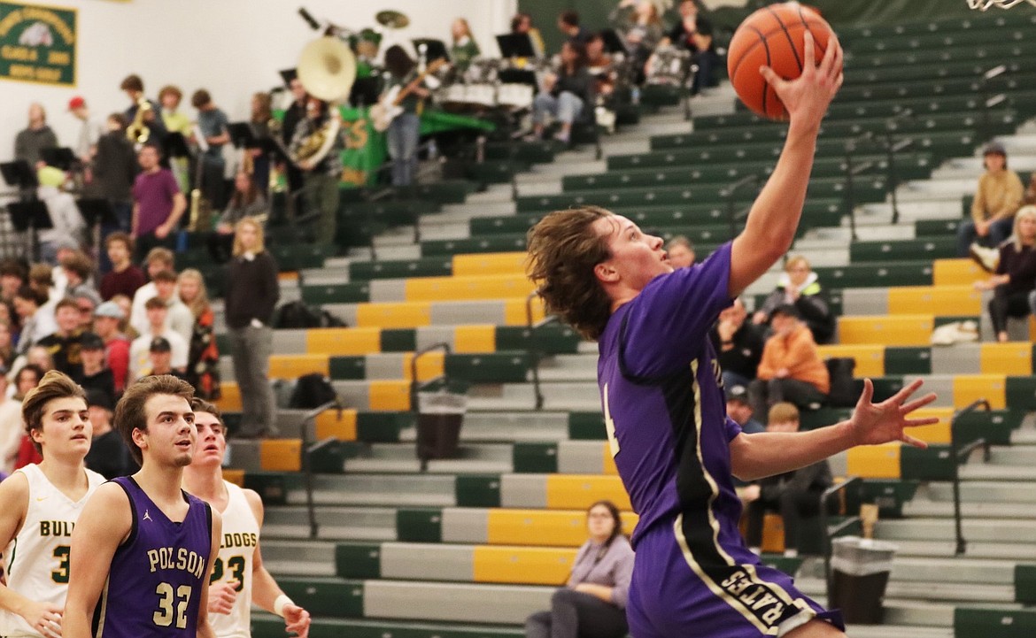 Xavier Fisher drives for a layup against Whitefish. (Courtesy of Niki Graham)