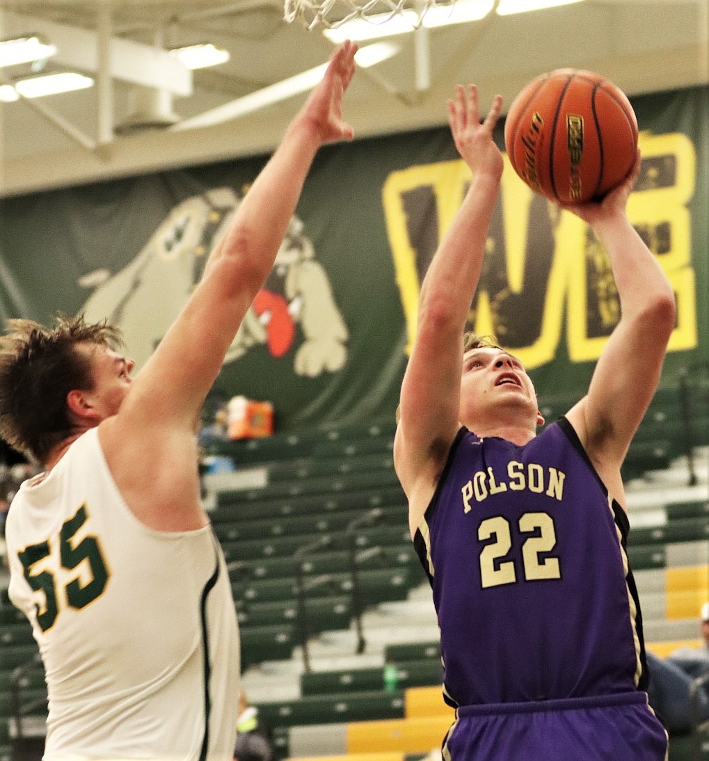 Polson's Trent Wilson drives for a layup against Whitefish. (Courtesy of Niki Graham)