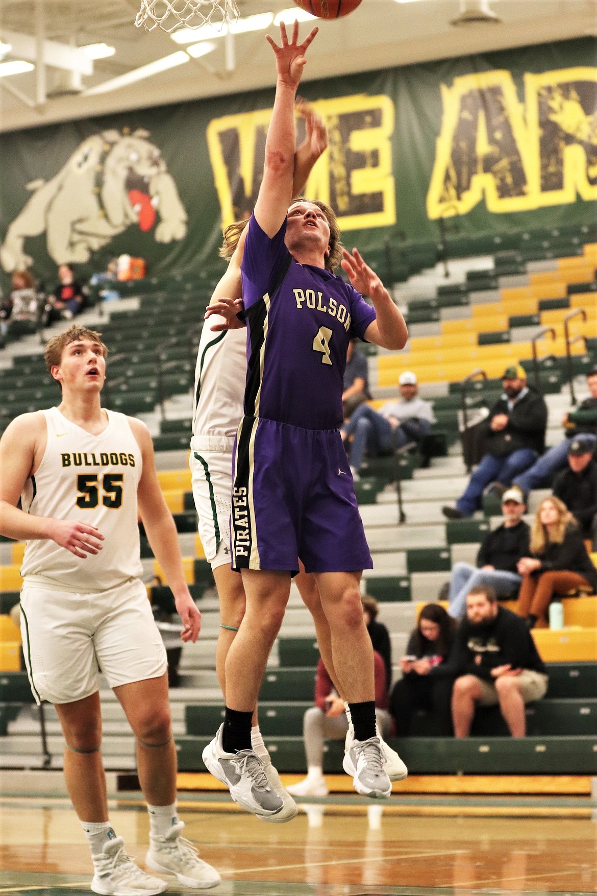 Xavier Fisher goes up for a rebound against Whitefish. (Courtesy of Niki Graham)