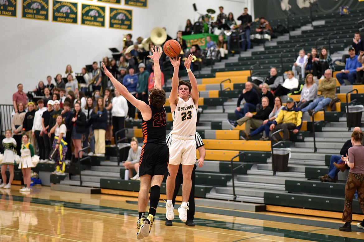 Bulldog junior Fynn Ridgeway goes for a 3-pointer against Eureka on Thursday. (Whitney England/Whitefish Pilot)