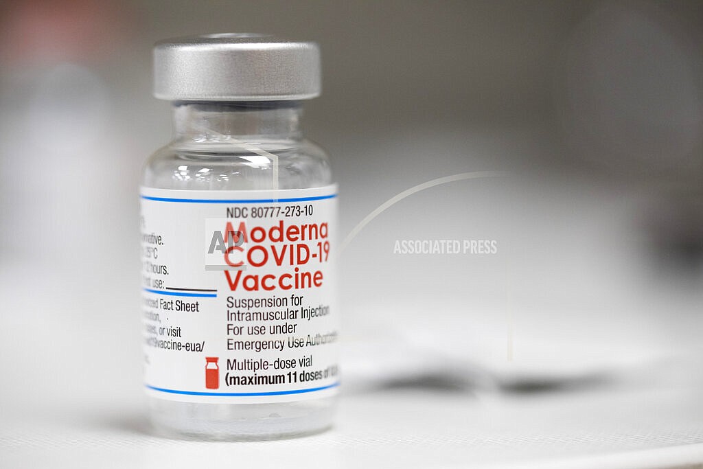 A vial of the Moderna COVID-19 vaccine is displayed on a counter at a pharmacy in Portland, Ore., Monday, Dec. 27, 2021. U.S. regulators have granted full approval to Moderna’s COVID-19 vaccine after reviewing additional data on its safety and effectiveness. The decision Monday, Jan. 31, 2022 by the Food and Drug Administration comes after many tens of millions of Americans have already received the shot under its original emergency authorization. Full approval means FDA has completed the same rigorous, time-consuming review for Moderna’s shot as dozens of other long-established vaccines. (AP Photo/Jenny Kane)
