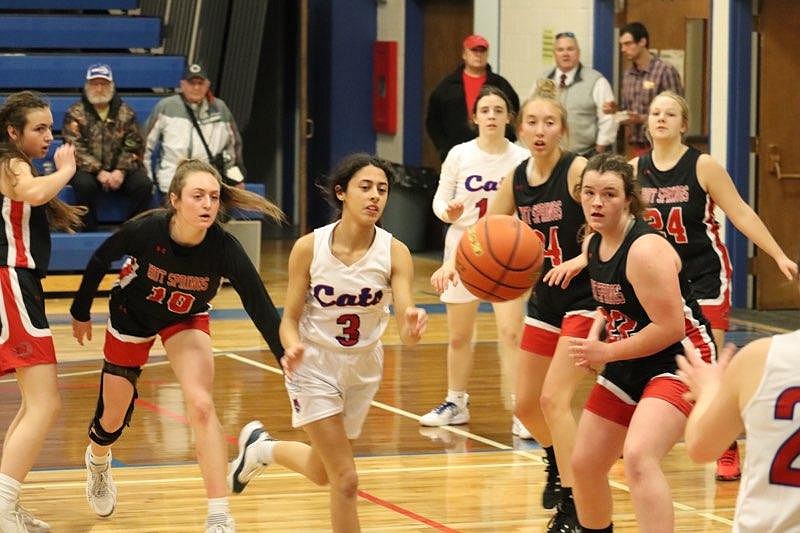 Hot Springs Katelyn Christensen (10) and Superior's Isabella Pereria (3) scramake for a loose ball during Fridays game in Superior. (Kami Milender for the MI)