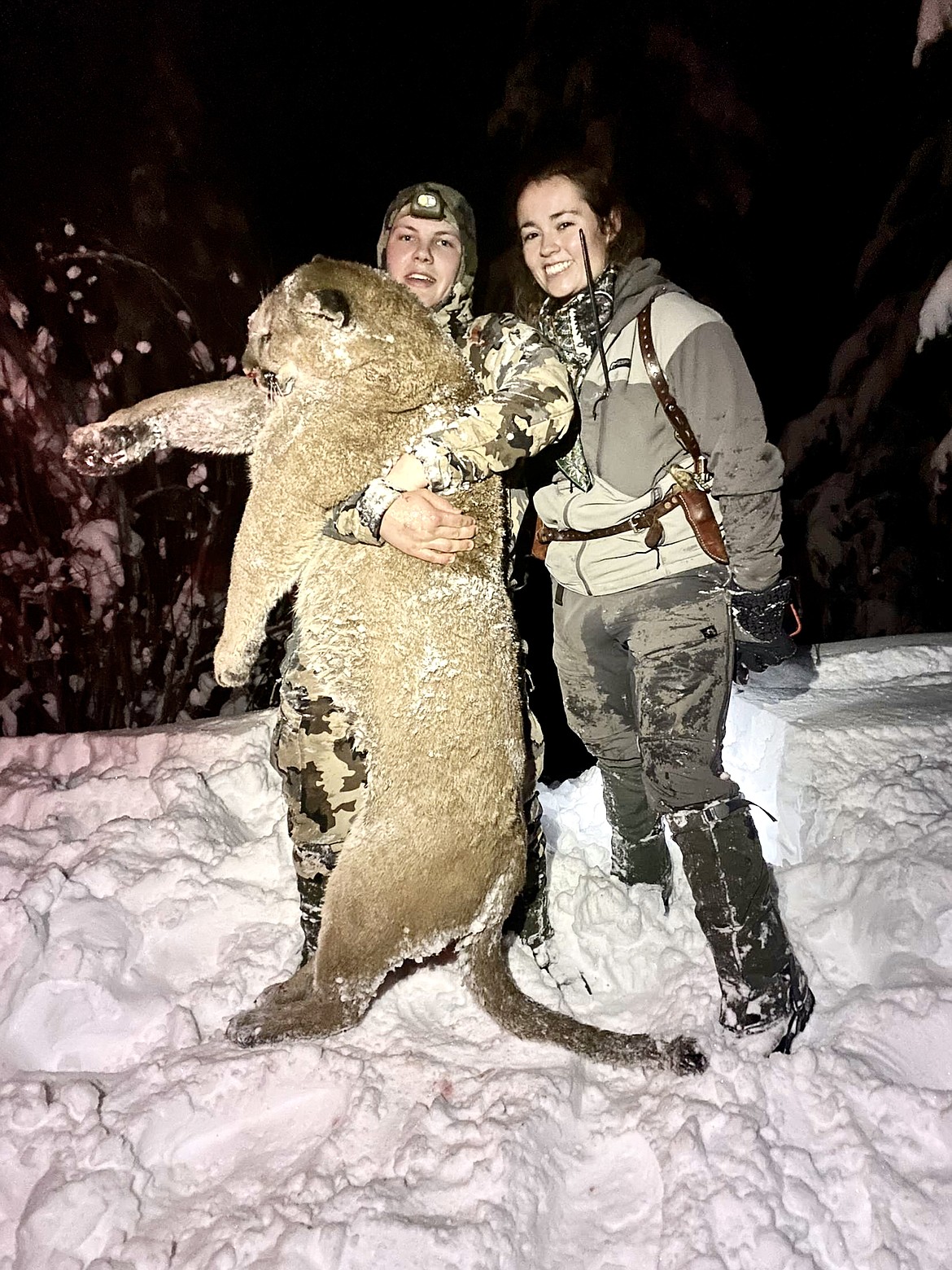 Adeline Richardson hunts for mountain lions and also helps others fill their tags, here she stands with a good friend who harvested a nice Tom this past winter. (Photo courtesy Adeline Richardson)