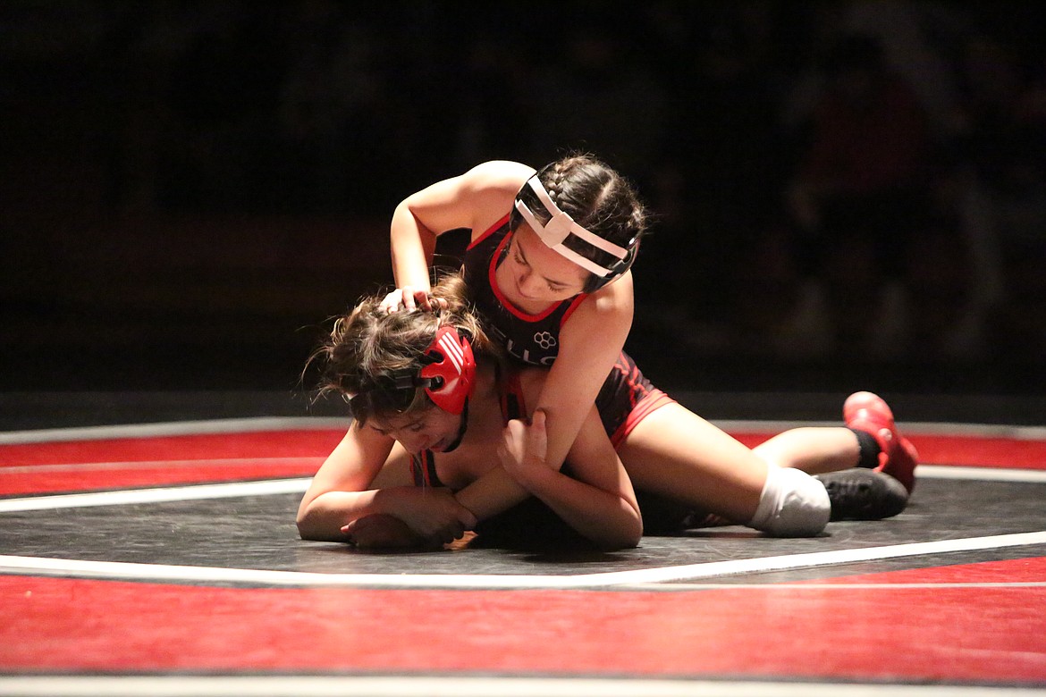 Ollonie Gonzalez, top, of Othello High School, works to pin her opponent Leylah Diaz, of East Valley High School, Thursday.