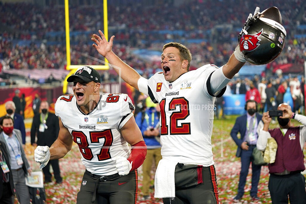 Tampa Bay Buccaneers tight end Rob Gronkowski, left, and quarterback Tom Brady (12) celebrate after the NFL Super Bowl 55 football game against the Kansas City Chiefs in Tampa, Fla., Feb. 7, 2021. Tom Brady has retired after winning seven Super Bowls and setting numerous passing records in an unprecedented 22-year-career. He made the announcement, Tuesday, Feb. 1, 2022, in a long post on Instagram. (AP Photo/Steve Luciano, File)