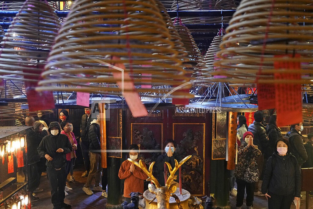 Worshipers pray during the Lunar New Year celebrations at the Man Mo temple in Hong Kong Tuesday, Feb. 1, 2022. The celebration marks the Year of the Tiger in the Chinese Zodiac calendar. (AP Photo/Vincent Yu)