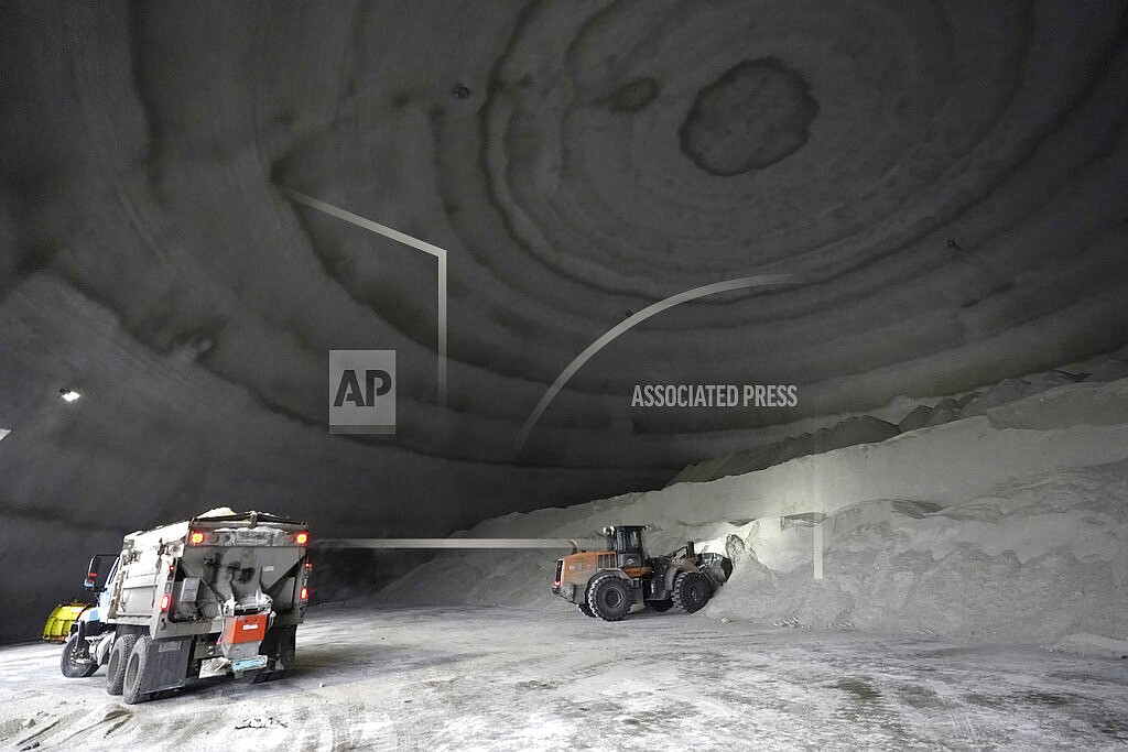 A City of Chicago Department of Streets and Sanitation salt truck waits for a load in a city salt dome in anticipation of a winter storm Tuesday, Feb. 1, 2022, in Chicago. A major winter storm is expected to affect a huge swath of the United States beginning Tuesday, with heavy snow starting in the Rockies and freezing rain as far south as Texas before it drops snow and ice on the Midwest. (AP Photo/Charles Rex Arbogast)