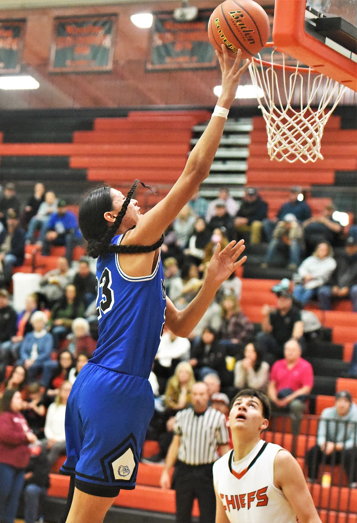 Cedrick McDonald rises to the rim in front of Ruben Couture. (Scot Heisel/Lake County Leader)