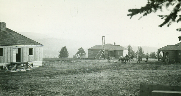 1937 picture of the new ranger station buildings
nearing completion. The buildings to the left and far right are still in use today. (Forest Service Northern Region Archives)