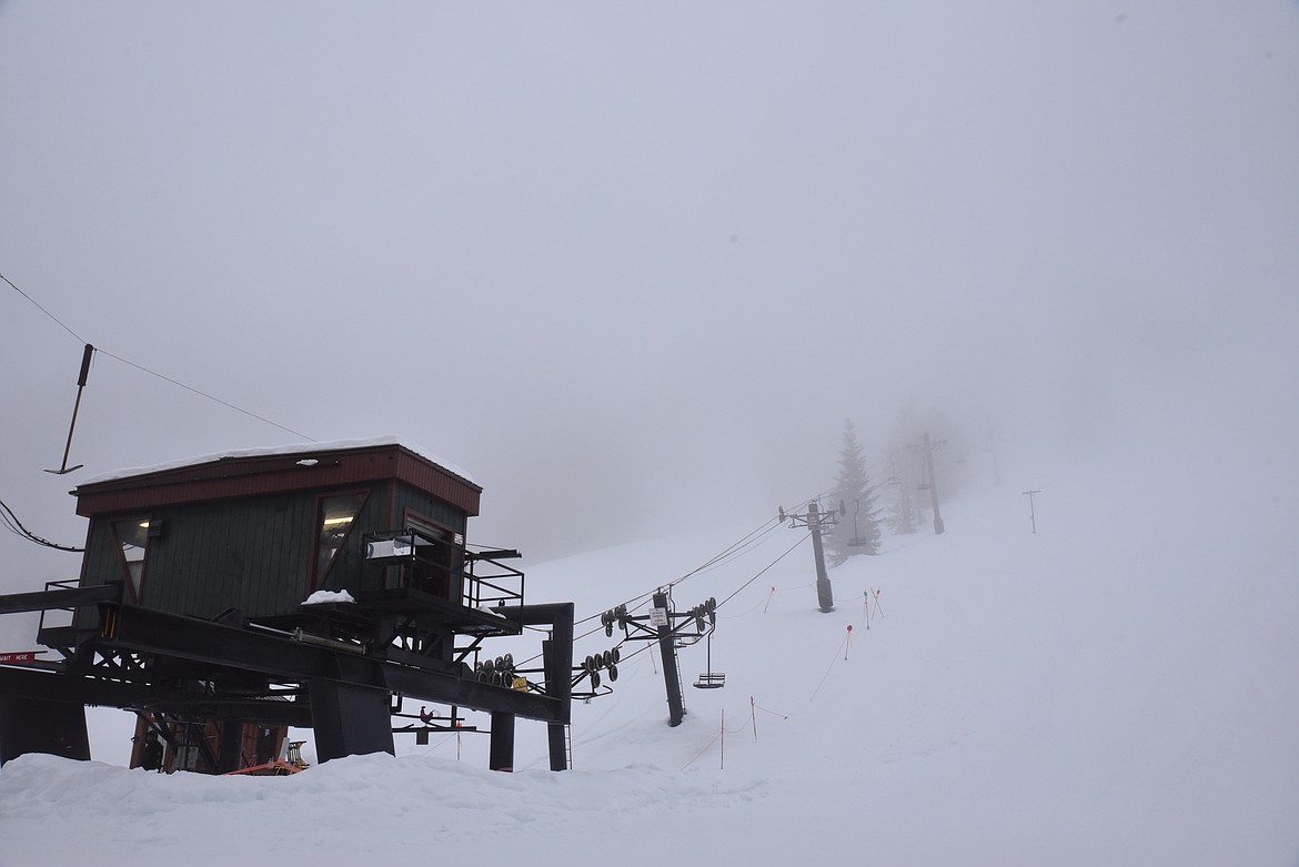 The sole chairlift at Turner Mountain Ski Area ferries skiers up into the clouds during a Friday in mid-January. (Derrick Perkins/The Western News)