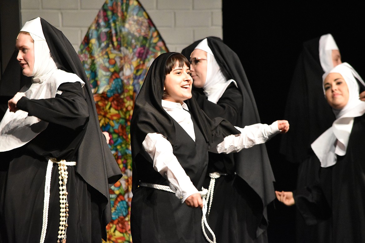 Sister Mary Robert (Abigail Castillo, center) lends her voice to the choir during rehearsal Wednesday for the Quincy Valley Allied Arts production of “Sister Act.”