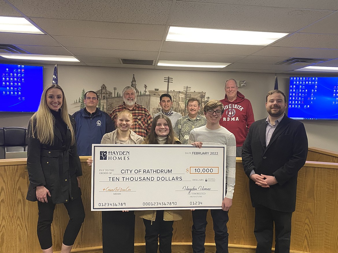 Back row from left: Councilman John Hodgkins, Mayor Vic Holmes, Jake Garringer from Governor Brad Little's office, and councilmen Neil Oliver and Steven Adams. Front row from left: Tori Morgan with Hayden Homes, winning students Izzy McCaslin, Catherine Roco, Riley Foutz and Russ Dowell with Hayden Homes. The city of Rathdrum student-led civic project presentations were heard Wednesday at Rathdrum City Hall. Two winning teams were chosen, both representing North Idaho STEM Charter Academy. With grants made possible by the city and Hayden Homes, each team has a $10,000 budget to bring their project vision to life.