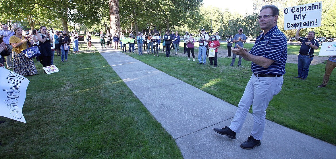 Former North Idaho College President Rick MacLennan looks at the crowd that came to wish him well outside his office on his last day at NIC on Sept. 23. MacLennan was fired without cause by the NIC board of trustees. He will receive in total just shy of half a million dollars to not finish the last year-and-a-half of his contract. BILL BULEY/Press