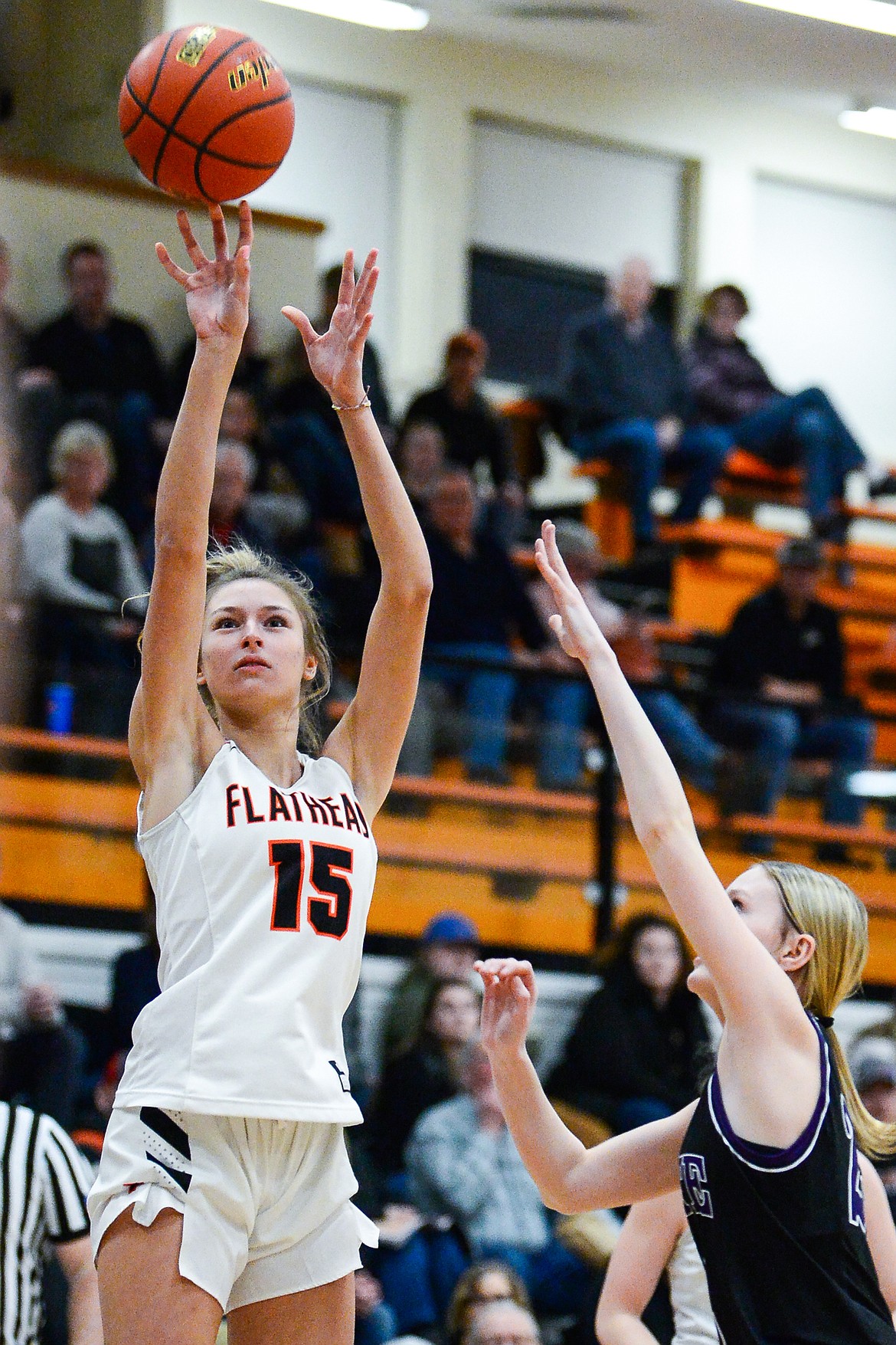 Flathead's Clare Converse (15) looks to shoot over Butte's Emmarie Richards (22) at Flathead High School on Friday, Feb. 4. (Casey Kreider/Daily Inter Lake)