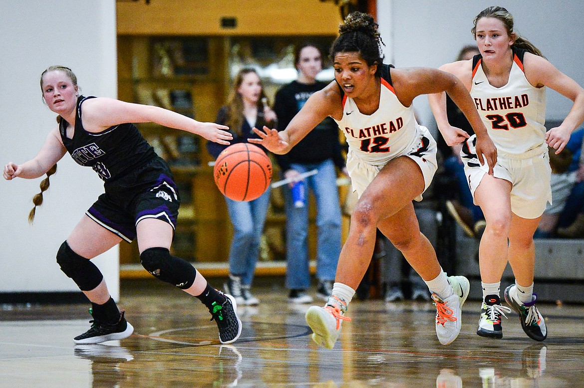 Flathead's Akilah Kubi (12) picks up a steal in the second half against Butte at Flathead High School on Friday, Feb. 4. (Casey Kreider/Daily Inter Lake)