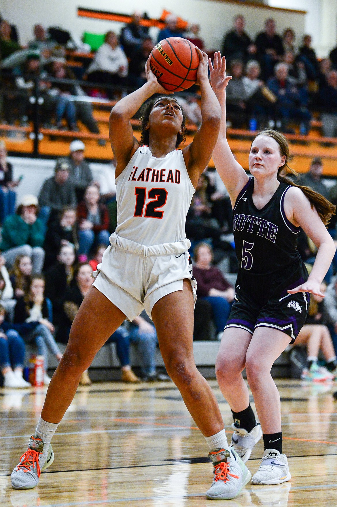 Flathead's Akilah Kubi (12) looks to shoot with Butte's Payton Clary (5) in pursuit at Flathead High School on Friday, Feb. 4. (Casey Kreider/Daily Inter Lake)