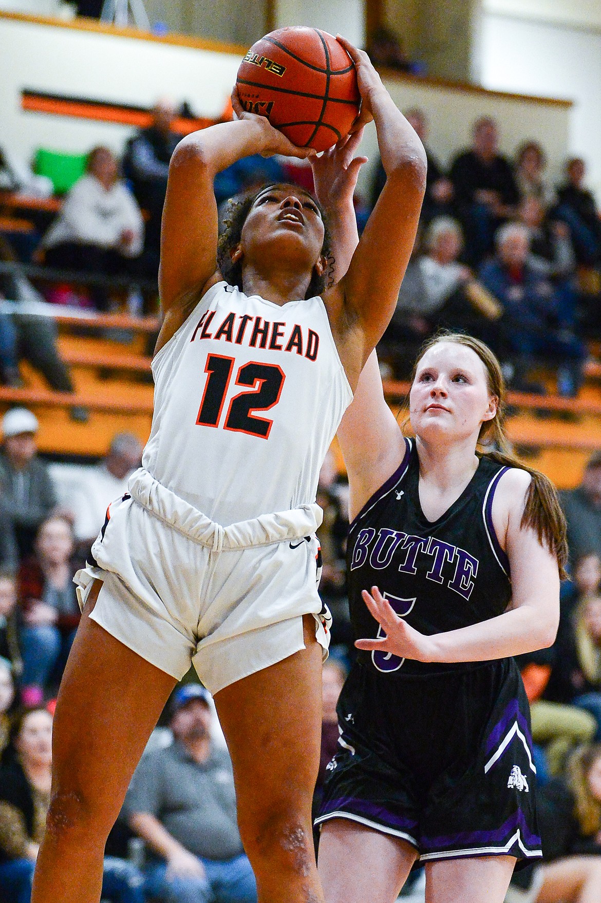 Flathead's Akilah Kubi (12) looks to shoot with Butte's Payton Clary (5) in pursuit at Flathead High School on Friday, Feb. 4. (Casey Kreider/Daily Inter Lake)