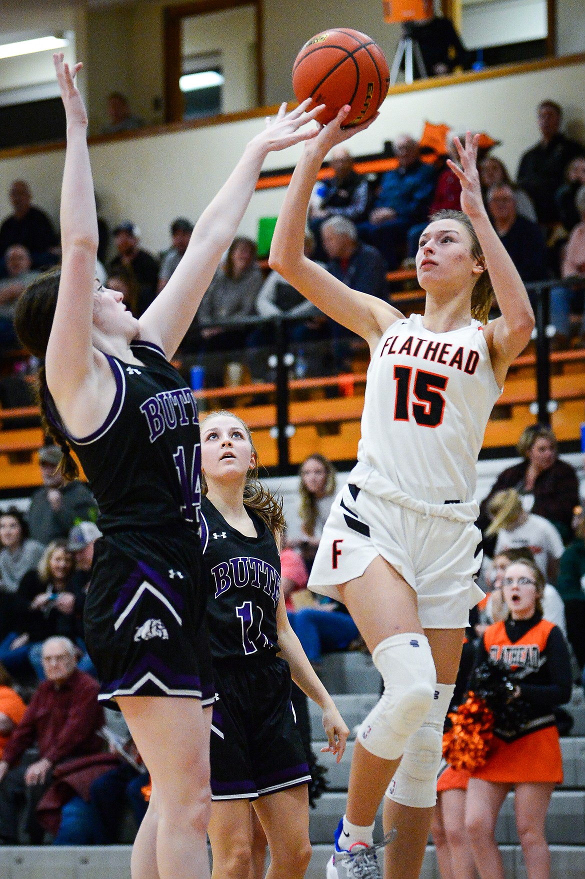 Flathead's Clare Converse (15) looks to shoot over Butte's Laura Rosenleaf (14) at Flathead High School on Friday, Feb. 4. (Casey Kreider/Daily Inter Lake)