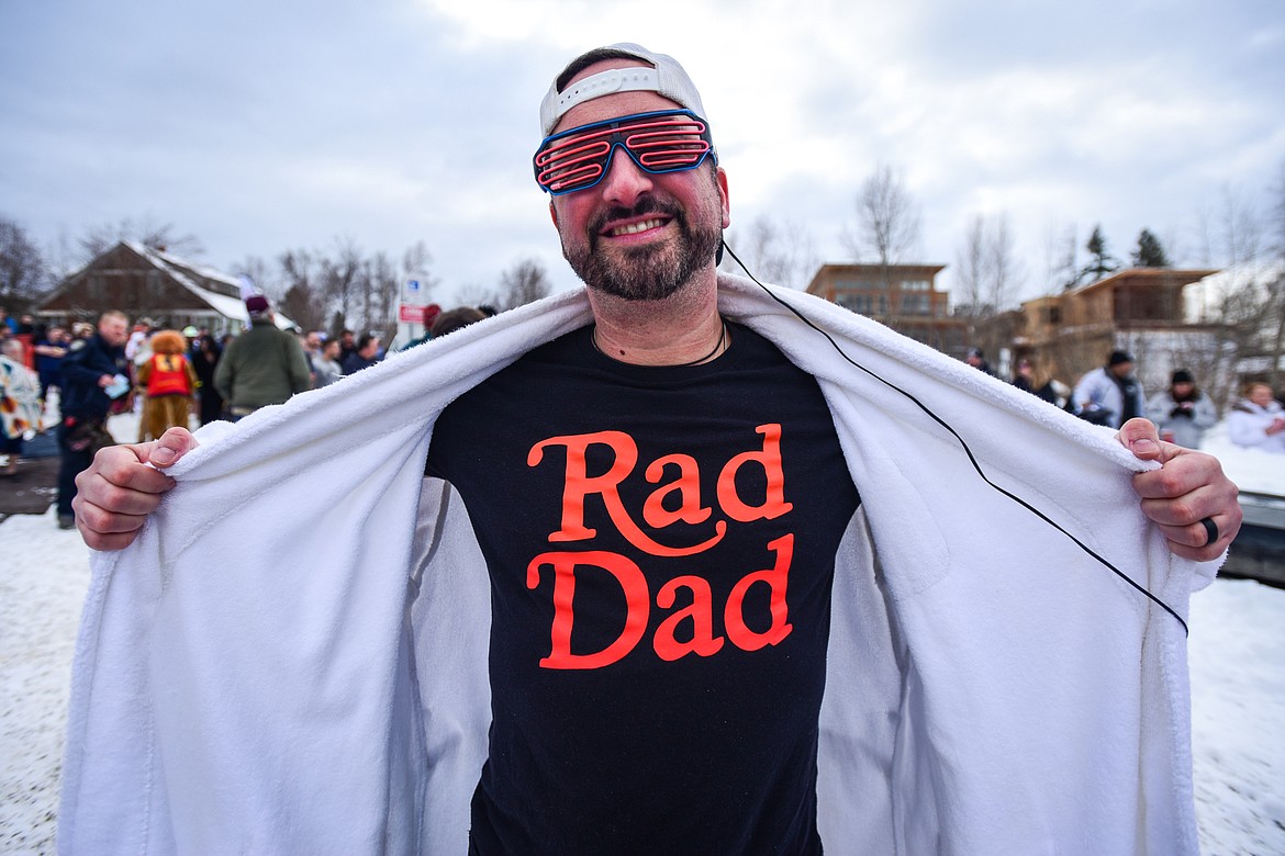 Mick Bedore shows off his costume before the  the Penguin Plunge at Whitefish Lake on Saturday, Feb. 5. Organized by the Law Enforcement Torch Run as part of the Whitefish Winter Carnival, the event raised over $60,000 for Special Olympics Montana. (Casey Kreider/Daily Inter Lake)