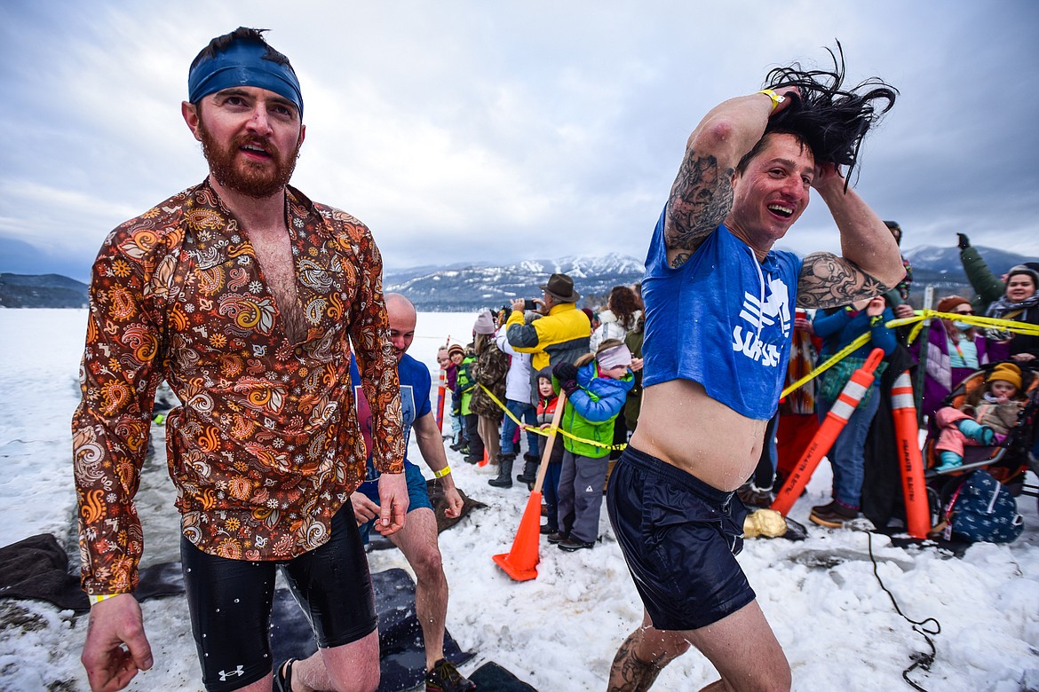 Participants step out of Whitefish Lake during the Penguin Plunge on Saturday, Feb. 5. Organized by the Law Enforcement Torch Run as part of the Whitefish Winter Carnival, the event raised over $60,000 for Special Olympics Montana. (Casey Kreider/Daily Inter Lake)