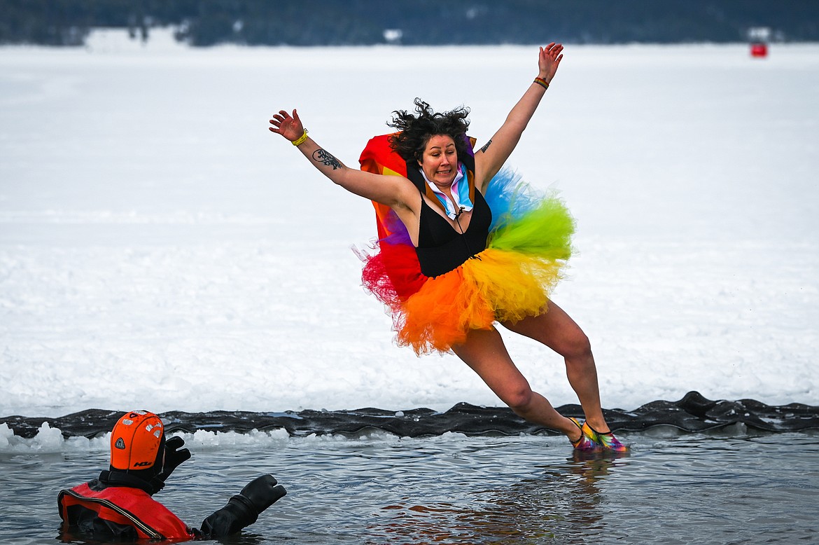 Ivalu Risager leaps into Whitefish Lake during the Penguin Plunge on Saturday, Feb. 5. Organized by the Law Enforcement Torch Run as part of the Whitefish Winter Carnival, the event raised over $60,000 for Special Olympics Montana. (Casey Kreider/Daily Inter Lake)