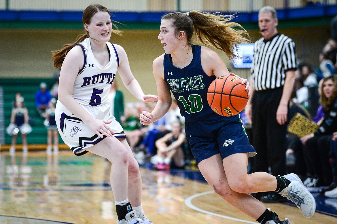 Glacier's Bethany Sorensen (10) drives to the basket guarded by Butte's Payton Clary (5) at Glacier High School on Saturday, Feb. 5. (Casey Kreider/Daily Inter Lake)