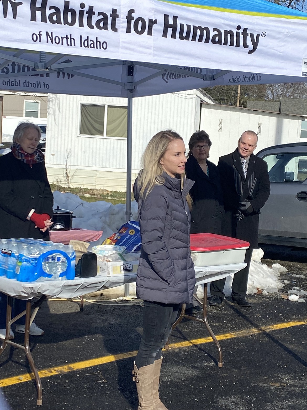 Alina Swanson expresses gratitude to about 50 guests gathered for the dedication of Habitat for Humanity's six-unit housing complex Saturday. Swanson, who learned about the project while volunteering for Habitat, will move in later this month with her 13-year-old son.