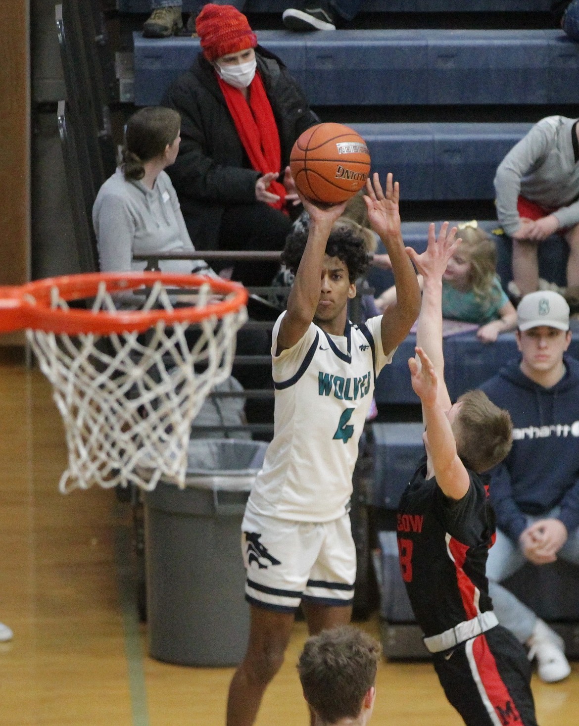 MARK NELKE/Press
Cason Miller (4) of Lake City eyes a jumper in the second half vs. visiting Moscow on Saturday.