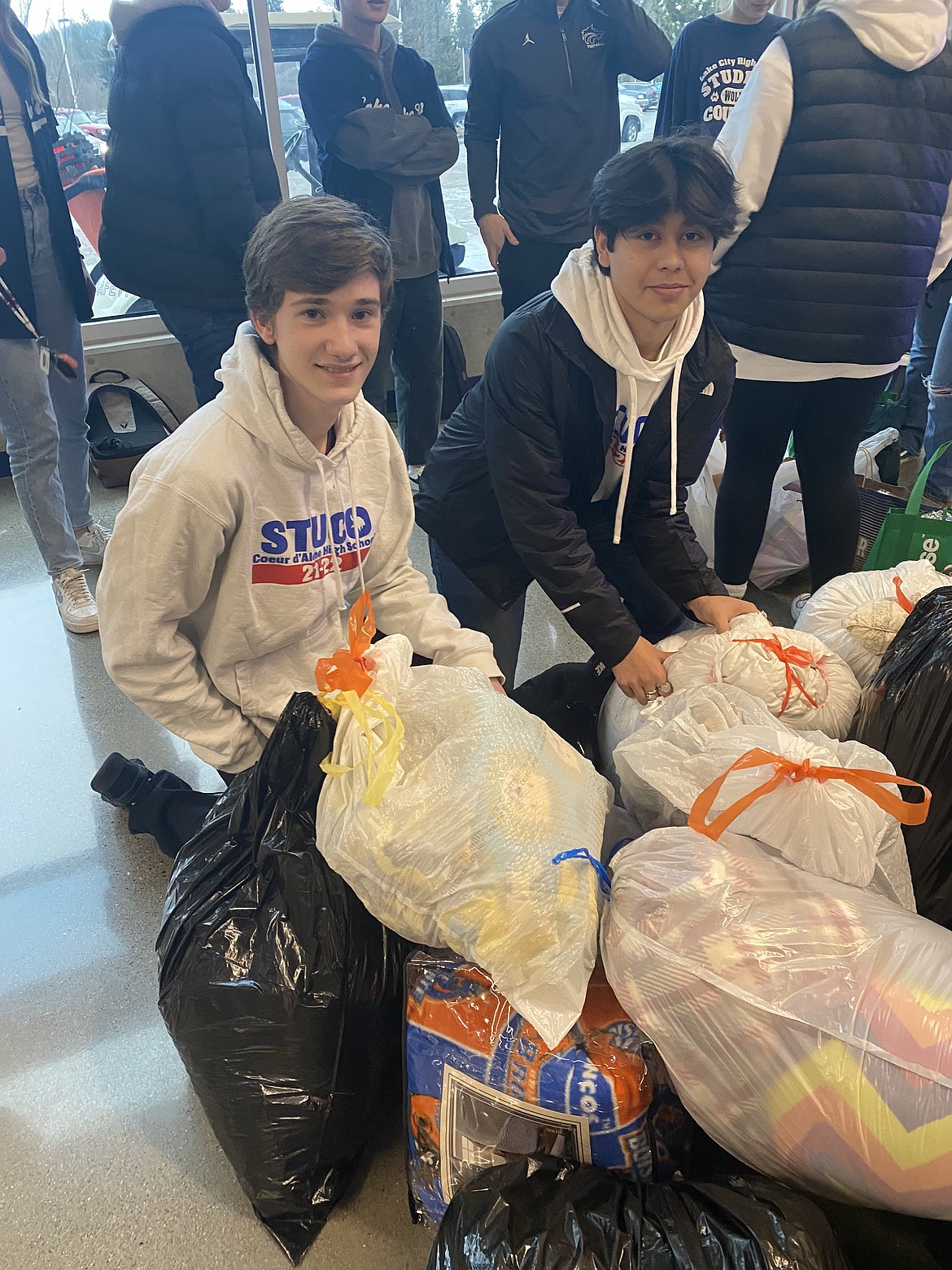 From left: CHS Student Council representatives Andrew Overland and Chief Allan are part of the All with AWL (All With Love) charity campaign run by the Coeur d'Alene and Lake City high schools. For the month of January, both student bodies collected needed items for clients of St. Vincent DePaul North Idaho, Safe Passage Violence Prevention Center, Union Gospel Mission and the Kootenai Humane Society.