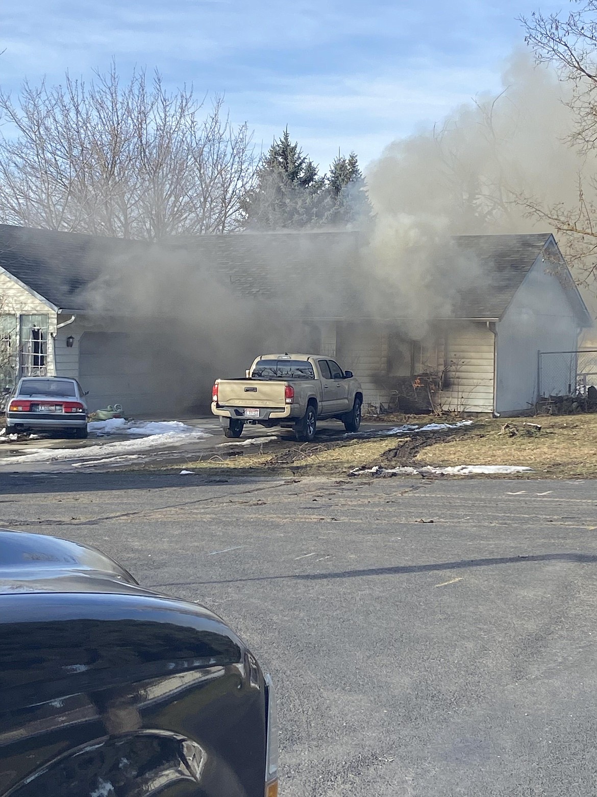 The suspect in a hostage situation Sunday in Hayden is believed to have set fire to the home where the hostages were safely released earlier in the afternoon.